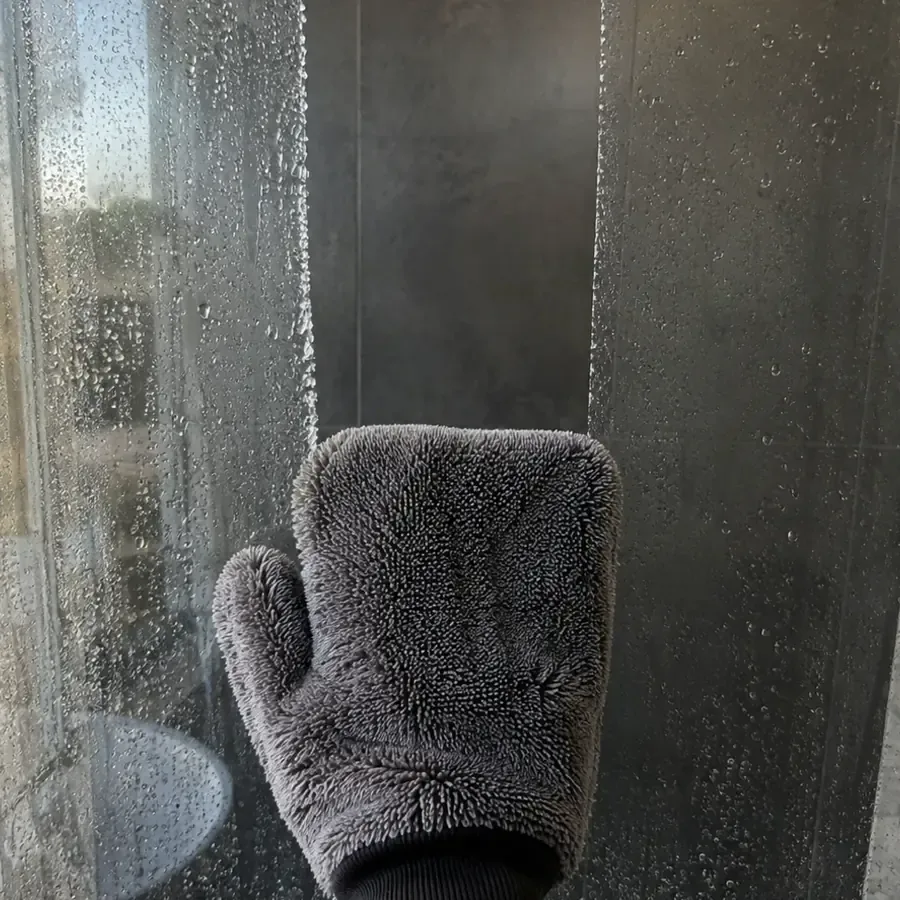 Pulling the GloveIt mitt down a shower glass door in one stroke