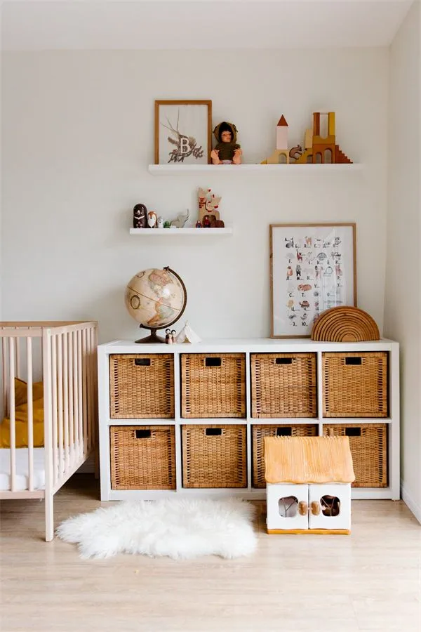 Calm nursery with a cot and storage shelves