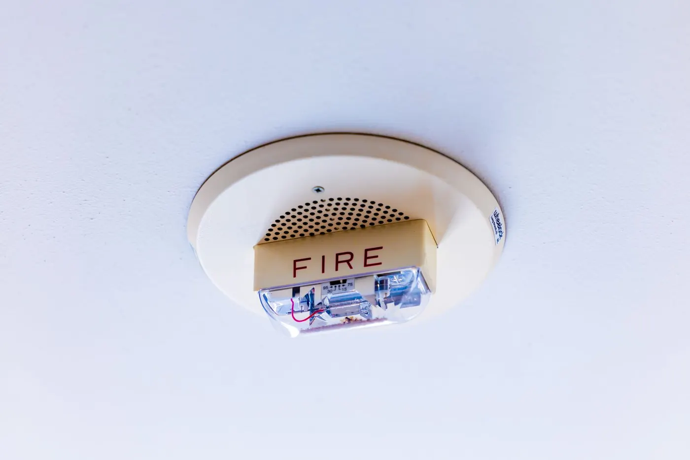 Ceiling-mounted smoke alarm — the single most important safety pairing for any bedroom space heater