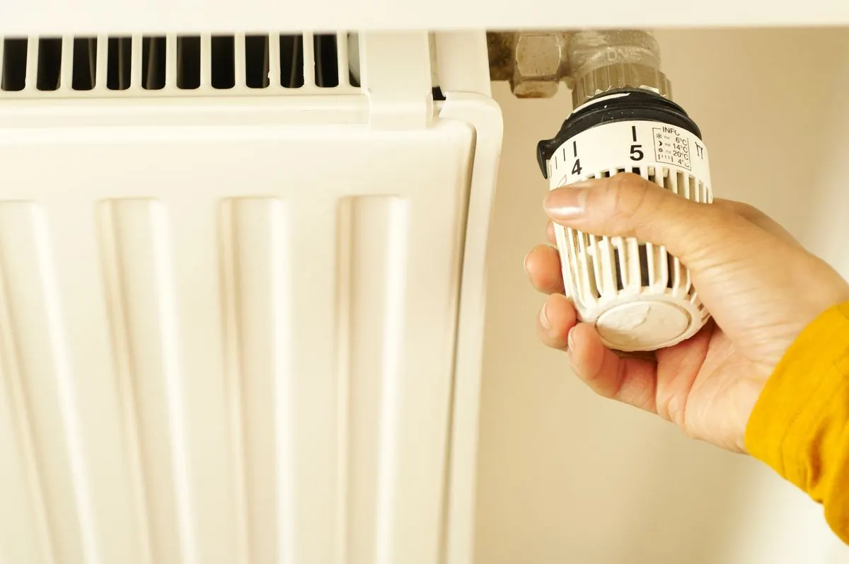Space heater safely placed on a hard floor away from curtains and furniture