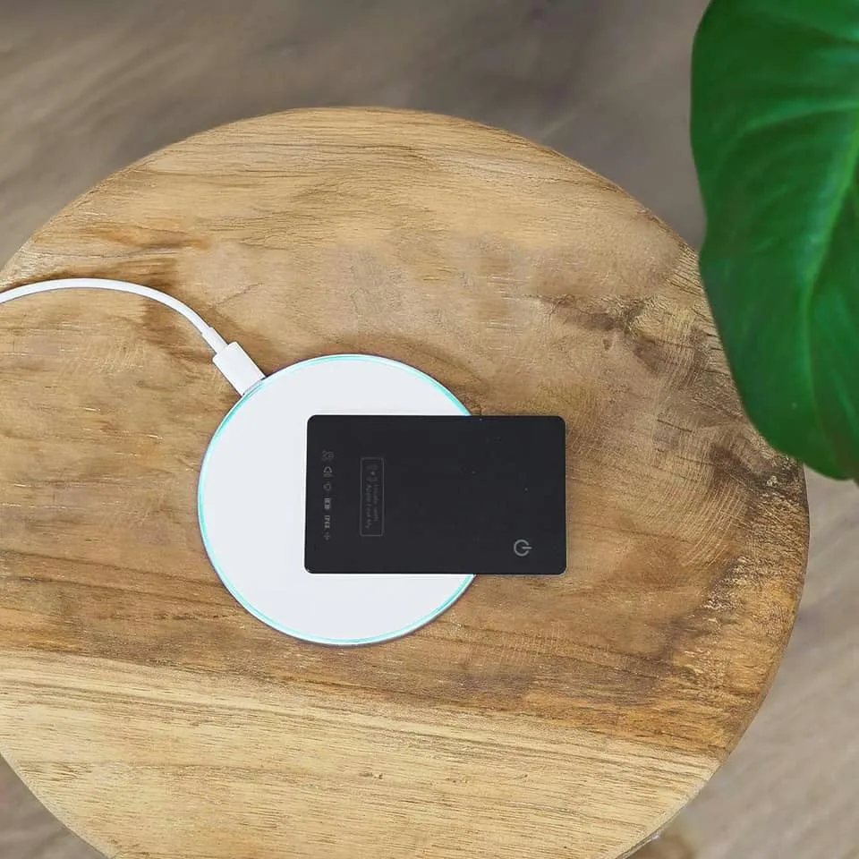 Tagsley tracking card charging wirelessly on a Qi charging pad
